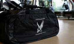 black montlcair state campus recreation duffle bag with the red hawk logo in white