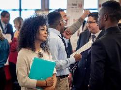 Employer speaking to a student at a Career Fair