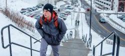 Image of student climbing stairs by CarParc in the snow