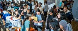 Image of students at a job fair on campus.