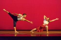 Photo of male and female dancers in extreme stretching poses.